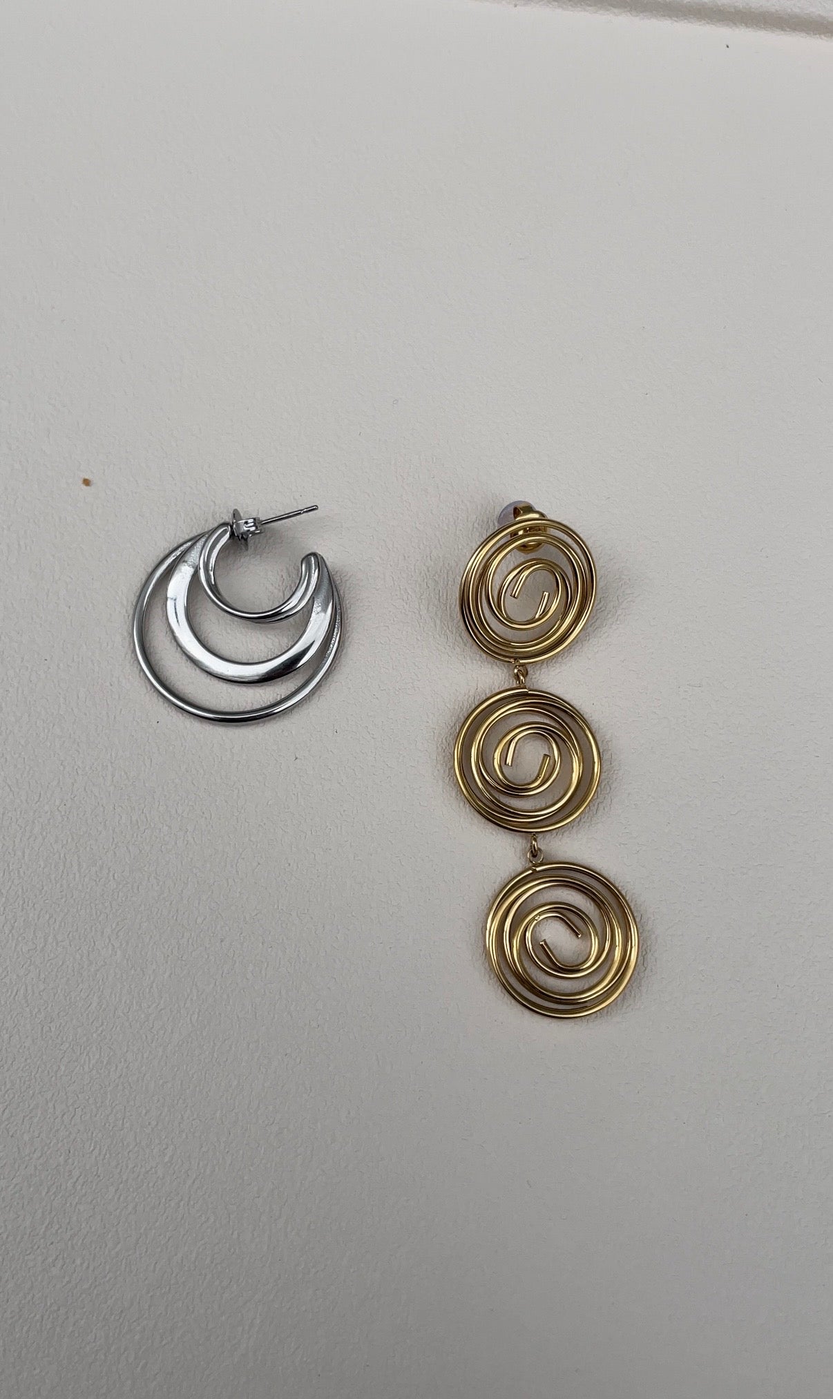Asymmetric whirlwind earrings