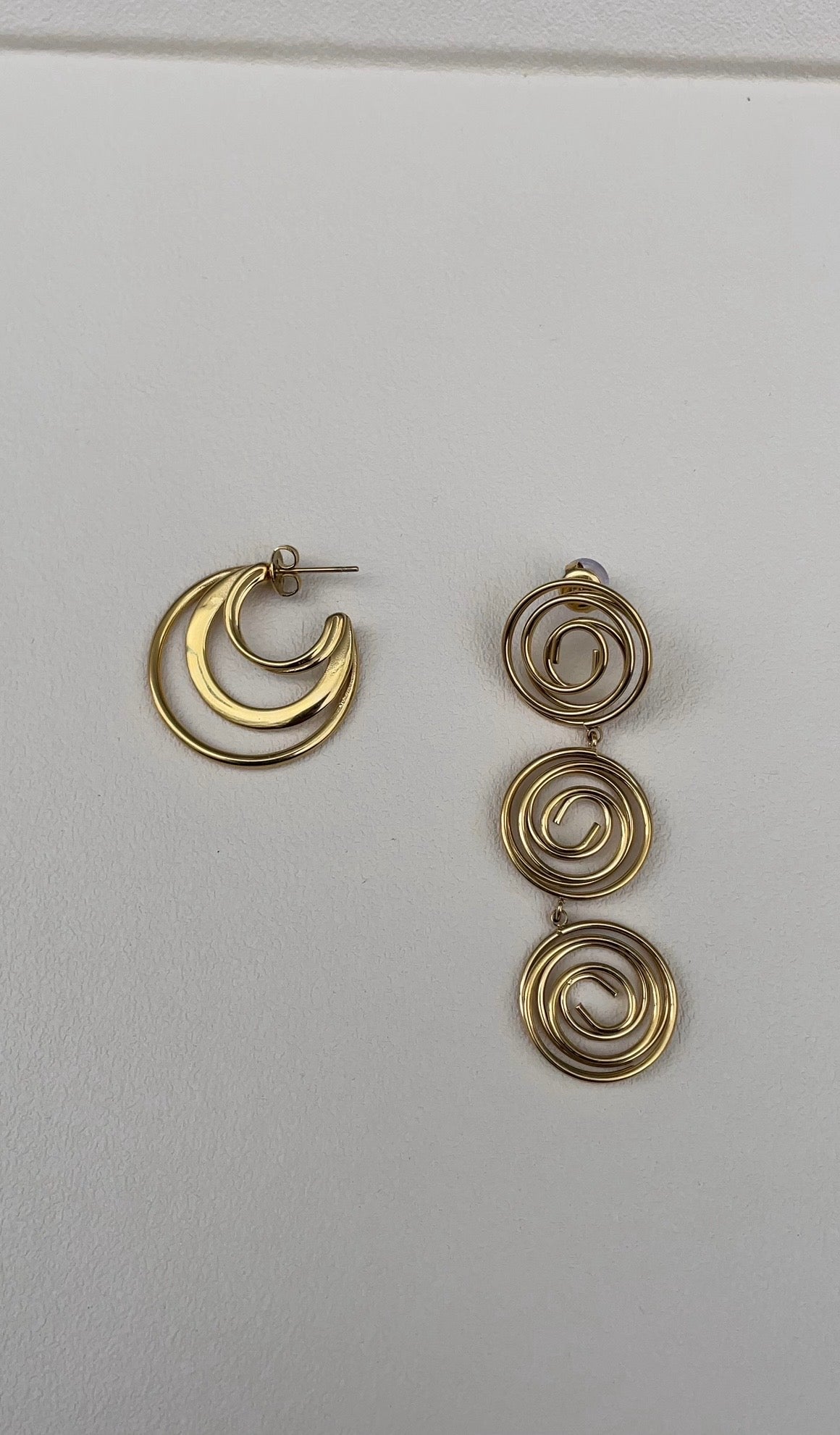 Asymmetric whirlwind earrings
