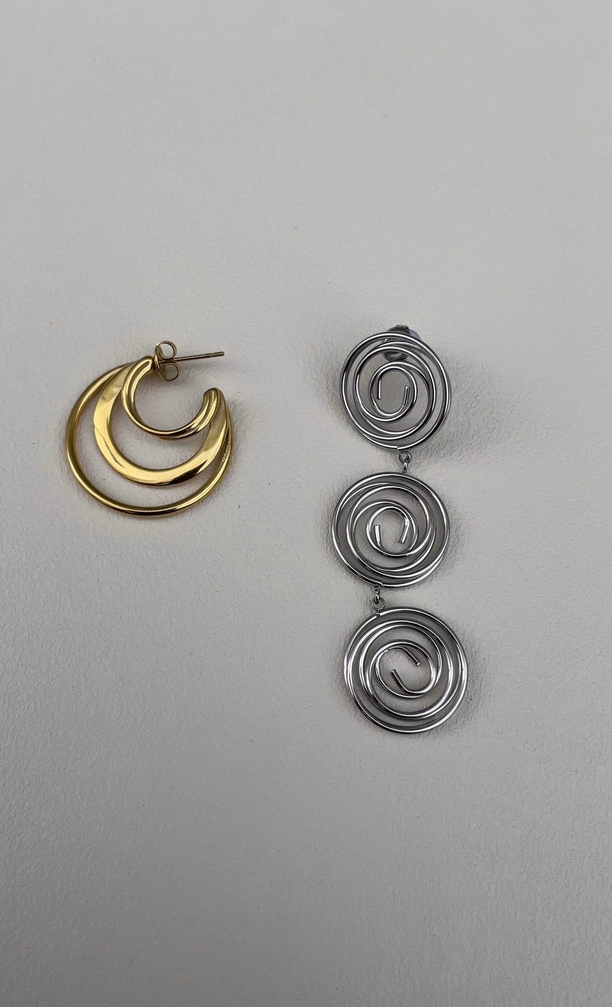 Asymmetric whirlwind earrings
