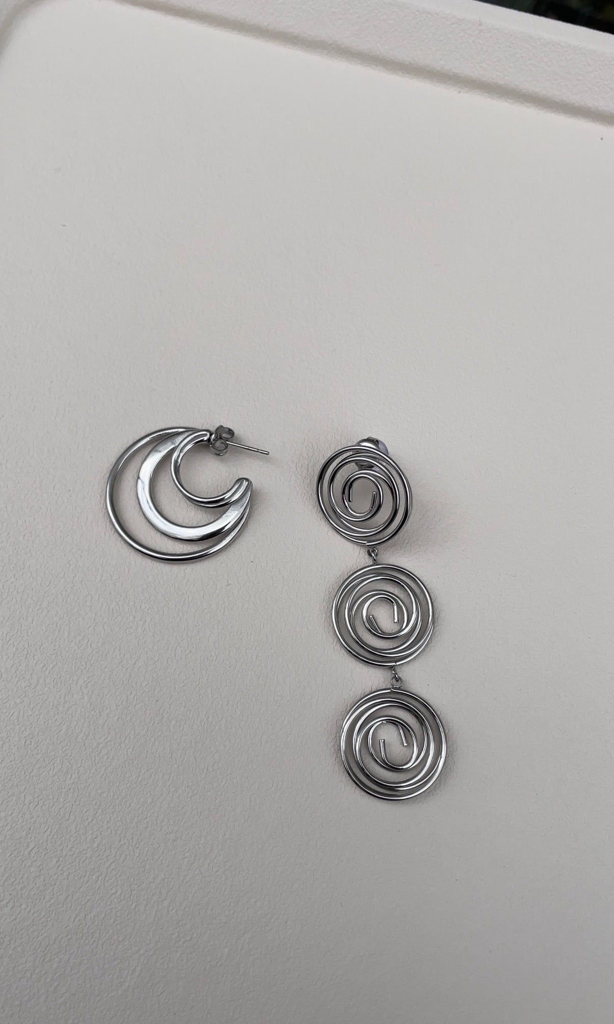 Asymmetric whirlwind earrings